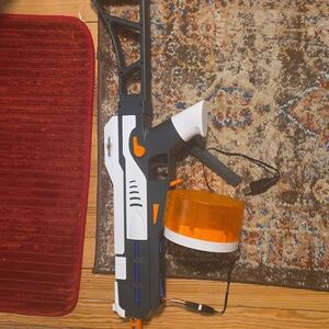 Black and White Toy Blaster with Orange Accents